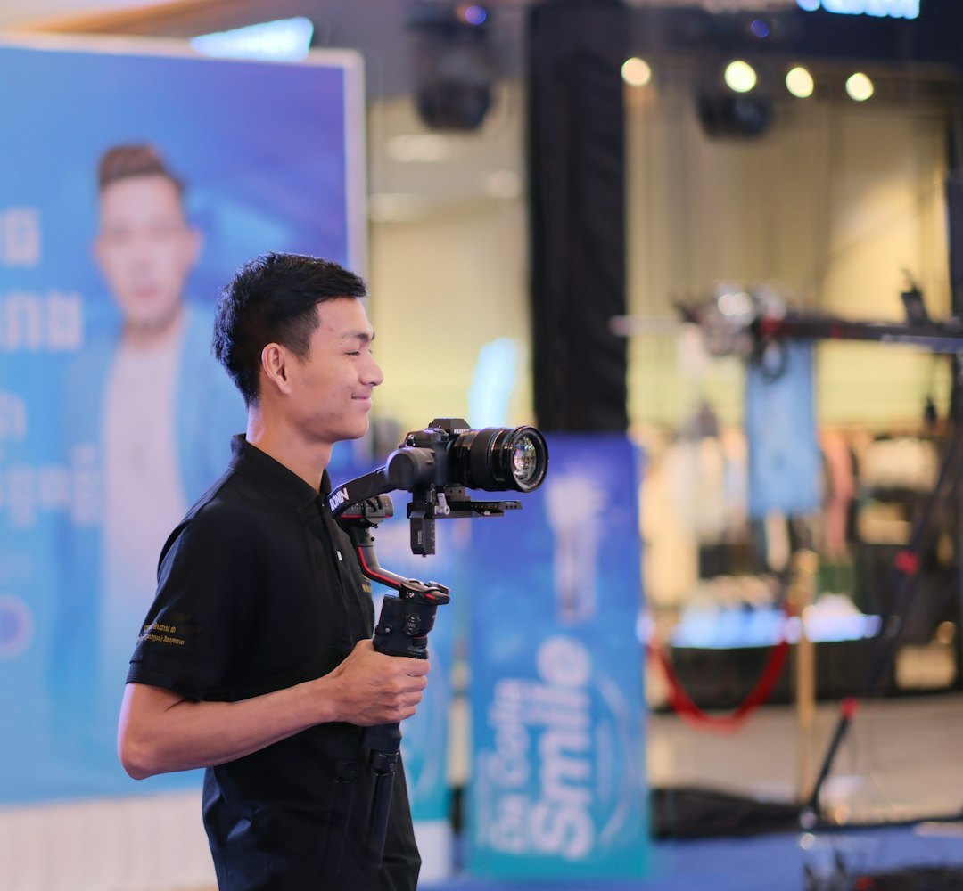 Student practicing on-camera presenting to a small crew