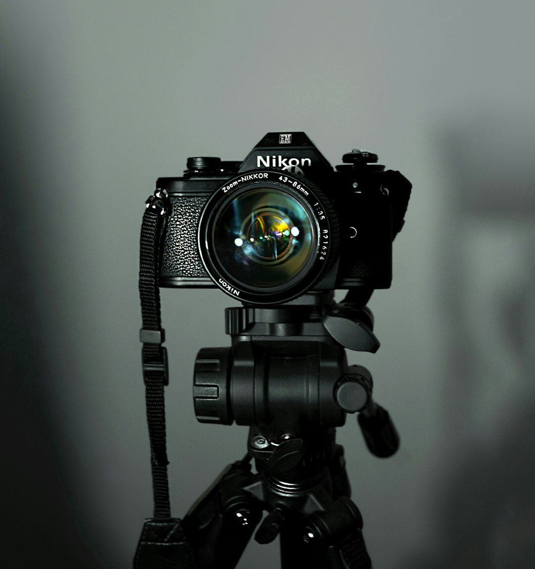Close-up of camera gear and tripod legs